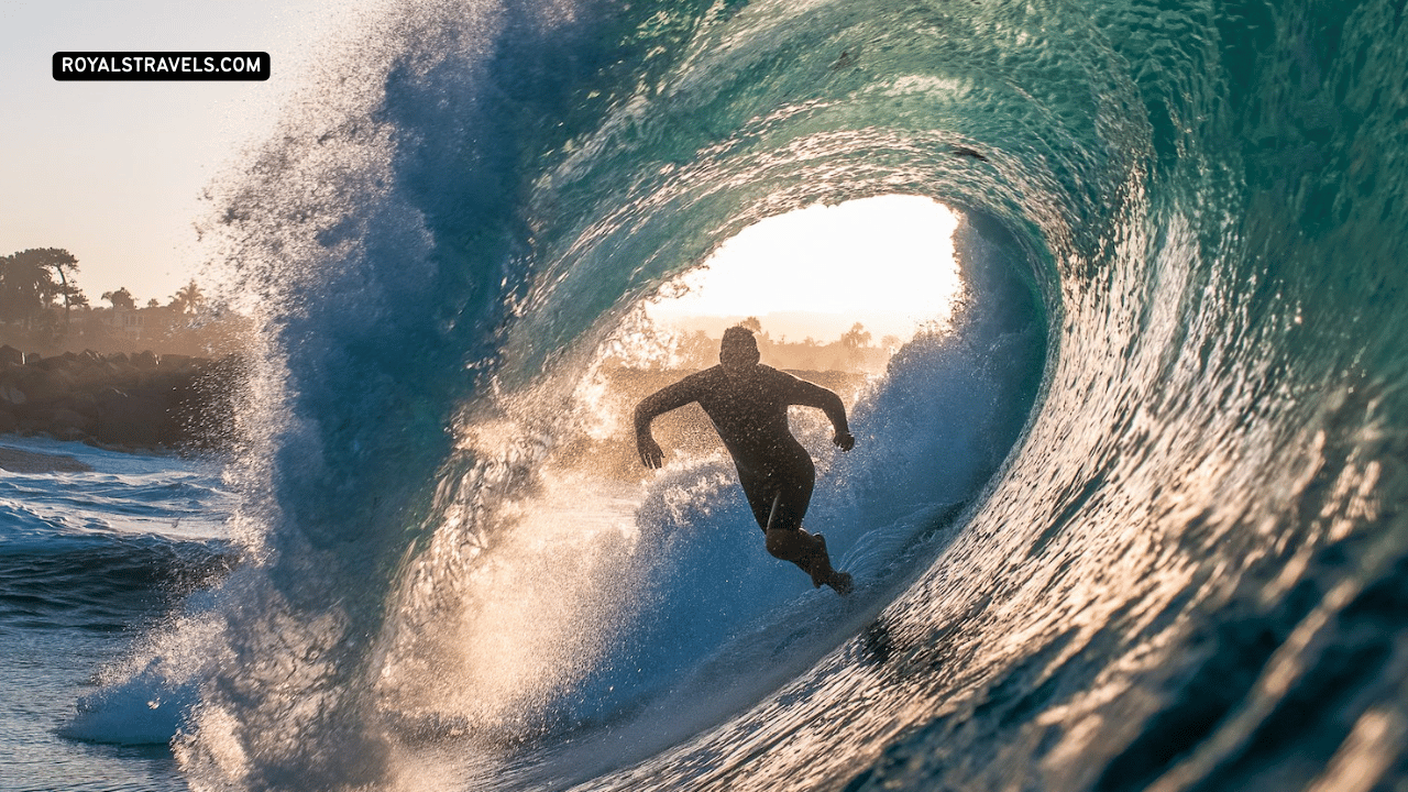 Surfer riding waves at a California beach – Malibu, Huntington Beach, Santa Cruz