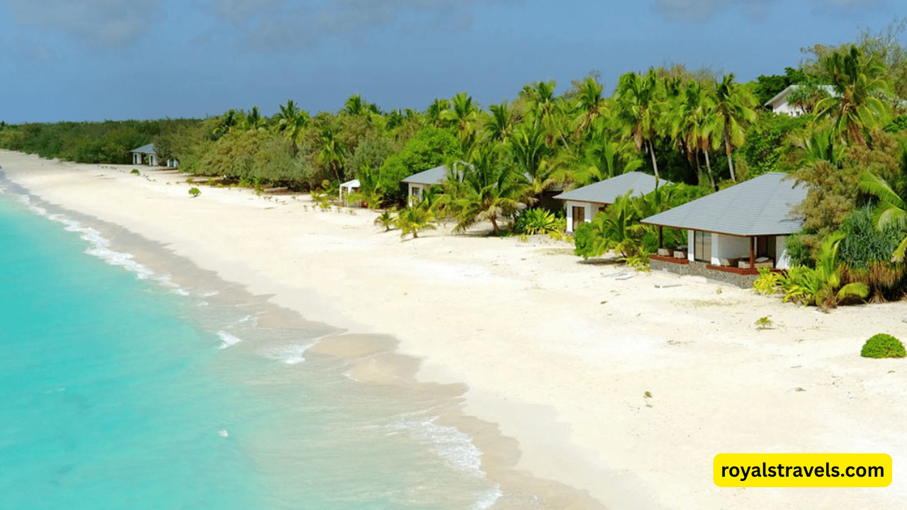 Overwater bungalows at Paradise D’Ouvea resort in New Caledonia surrounded by turquoise lagoon