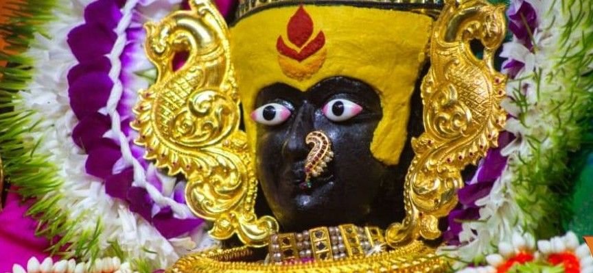 Goddess Vishalakshi Devi idol adorned with golden ornaments and floral garlands at Kashi Shaktipeeth