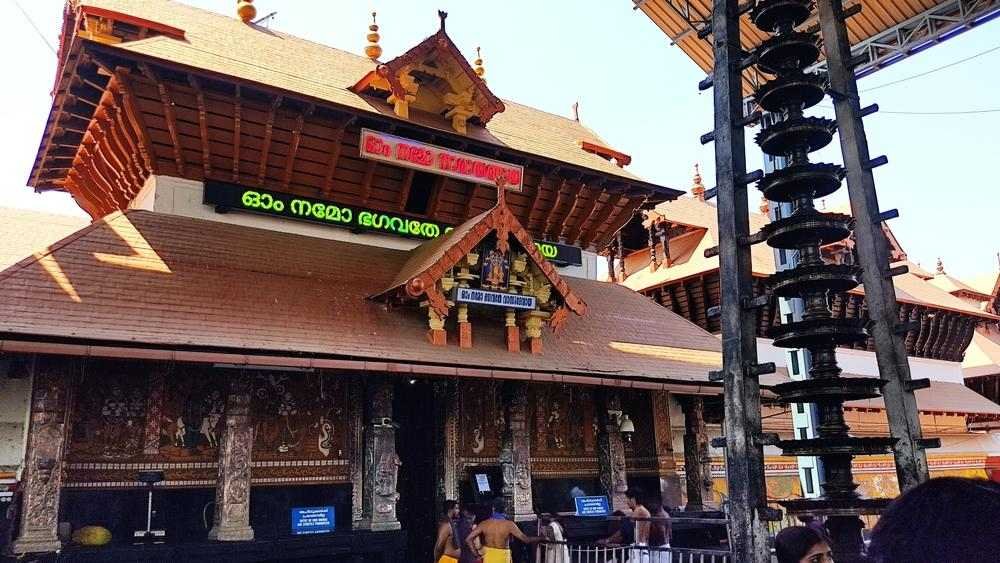 Guruvayur Temple entrance with traditional Kerala architecture and devotees