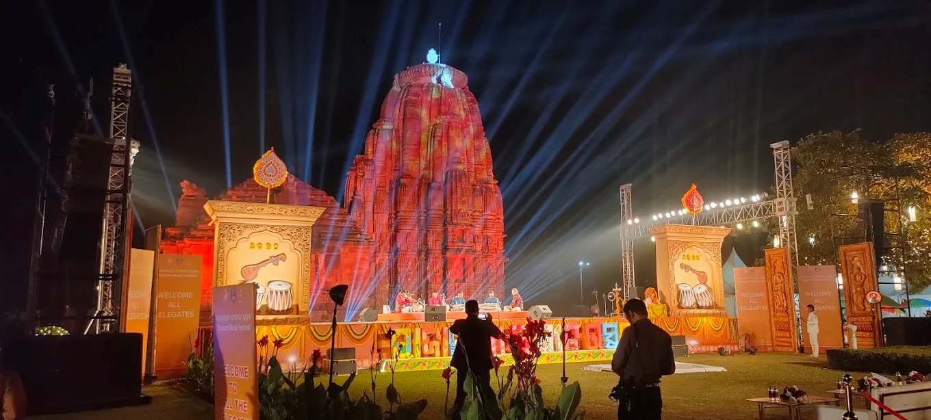 Raja Rani Music Festival at Raja Rani Temple in Bhubaneswar illuminated with colorful lights during a classical music performance.