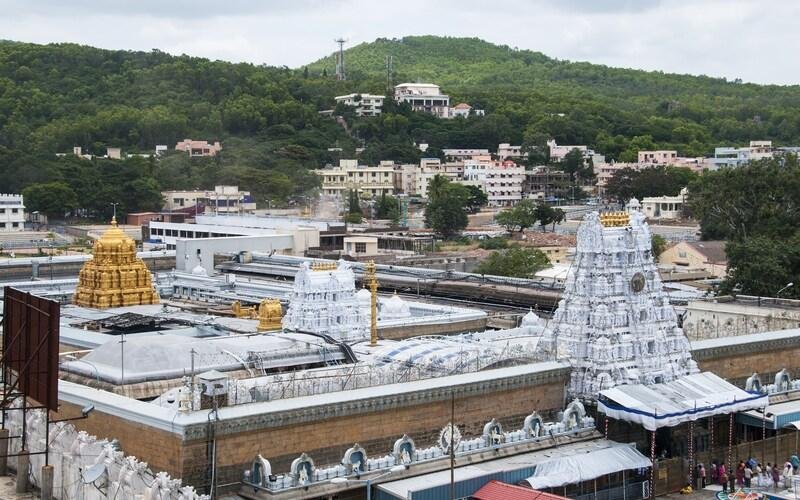 Beautiful aerial view of Tirumala Venkateswara Temple surrounded by lush green hills