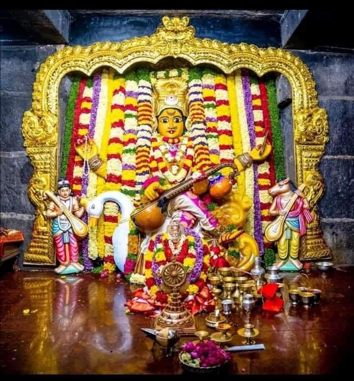 Bhadrakali Amma idol beautifully decorated with colorful flower garlands inside Bhadrakali Temple Warangal.