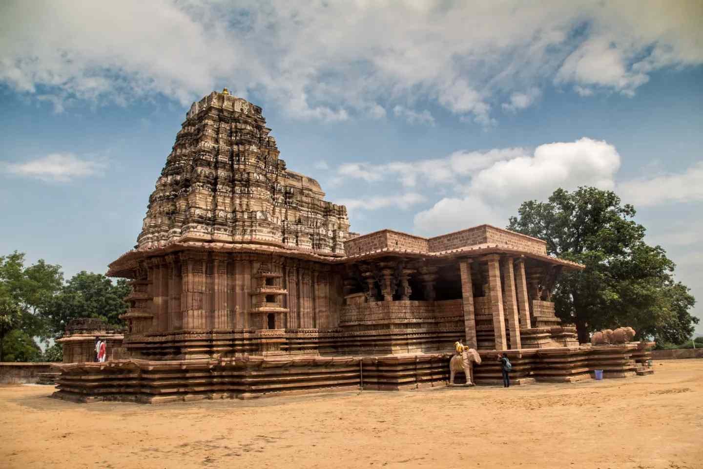 Ramappa Temple in Warangal, Telangana, showcasing magnificent Kakatiya architecture and the iconic sandstone structure under a blue sky.