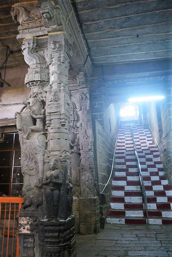 Ancient stone staircase and carved pillars inside Rockfort Temple, Tiruchirappalli.