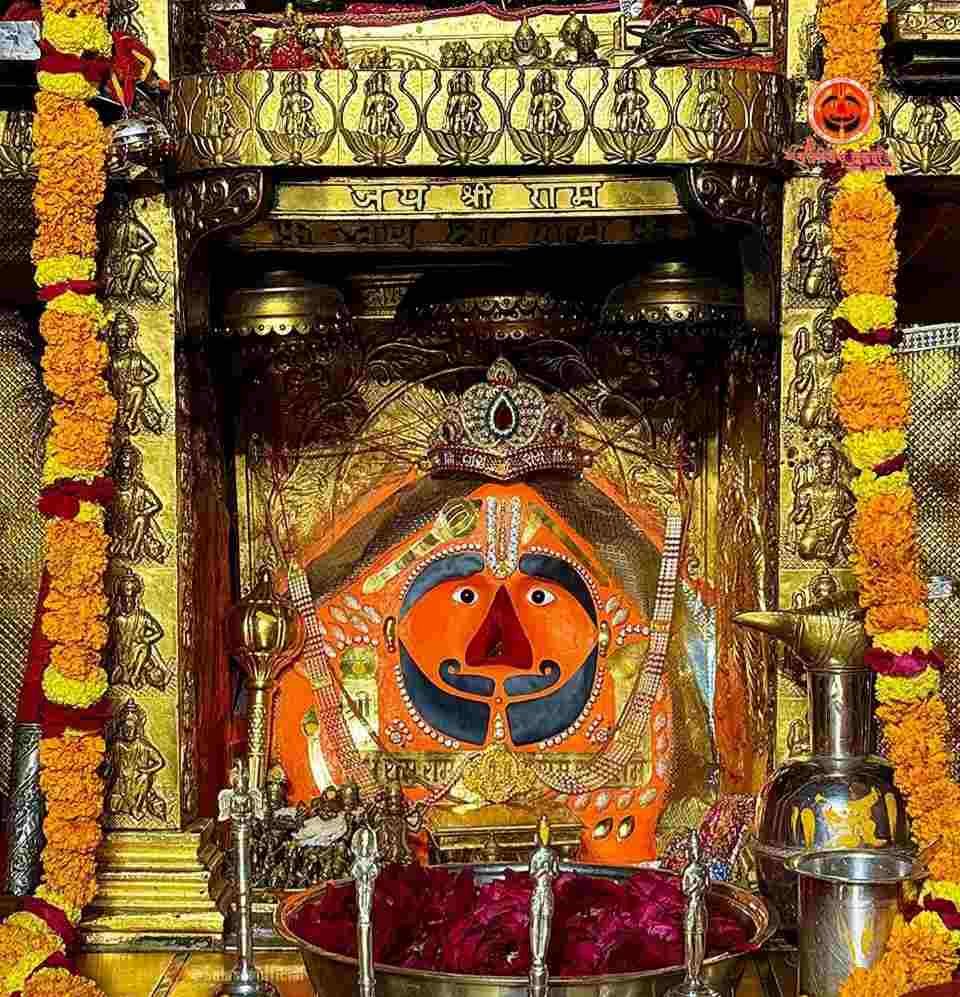 Sacred idol of Salasar Balaji decorated with flowers, ornaments, and traditional offerings inside the temple sanctum.