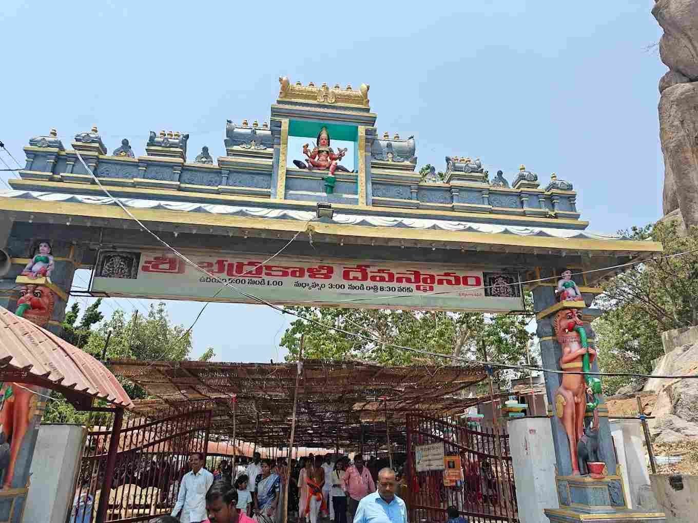 Main entrance gateway of Sri Bhadrakali Temple in Warangal with devotees entering for darshan.