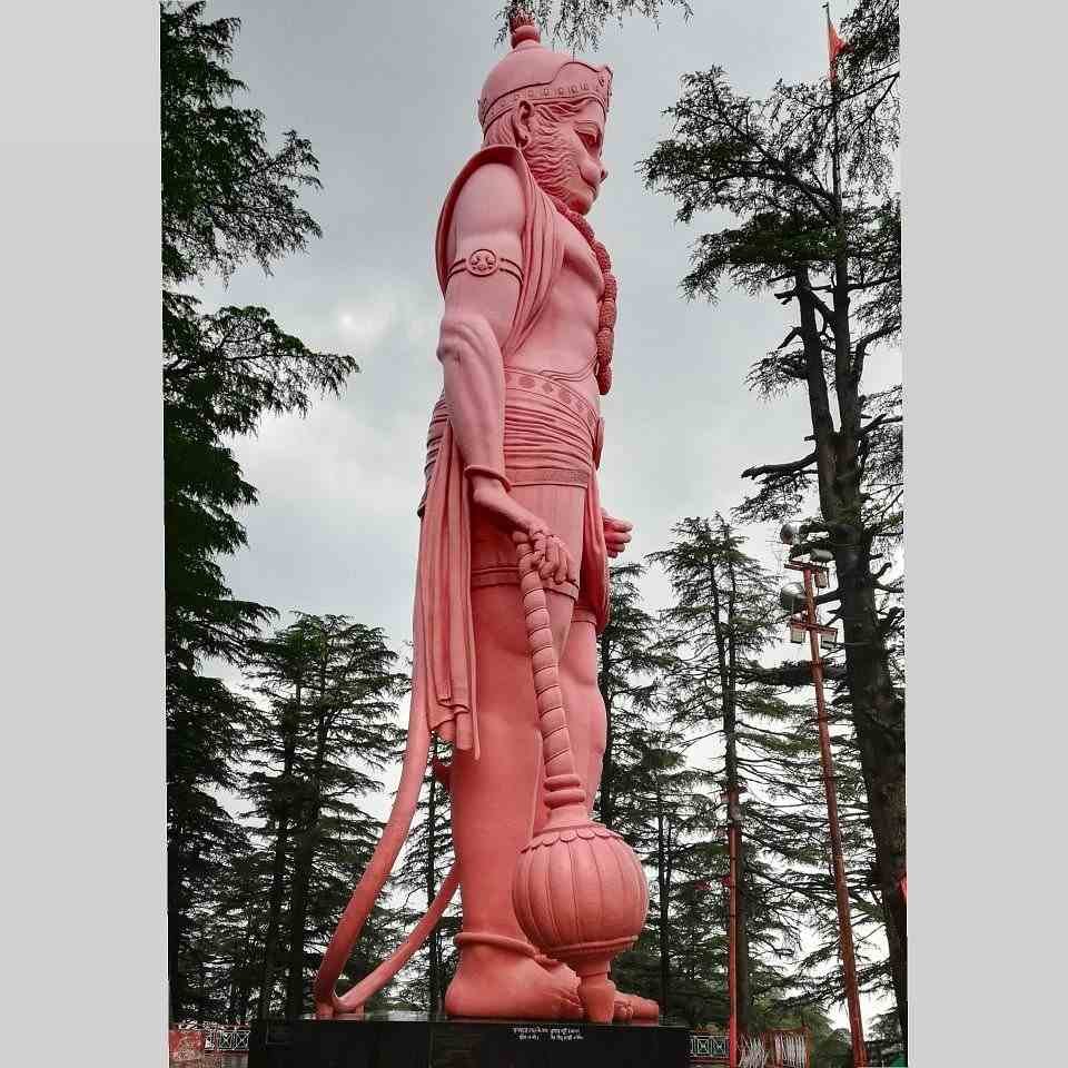 Side profile of the giant Hanuman statue at Jakhu Temple Shimla