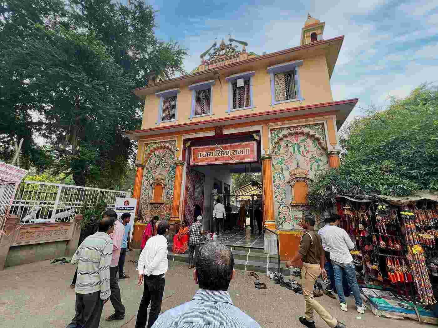 Main entrance of Sankat Mochan Hanuman Temple in Varanasi with devotees arriving for darshan.